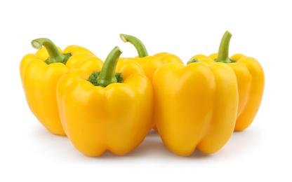 Photo of Ripe yellow bell peppers isolated on white