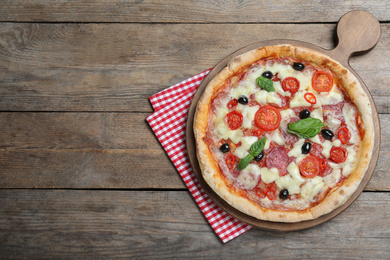 Delicious pizza Diablo on wooden table, top view. Space for text