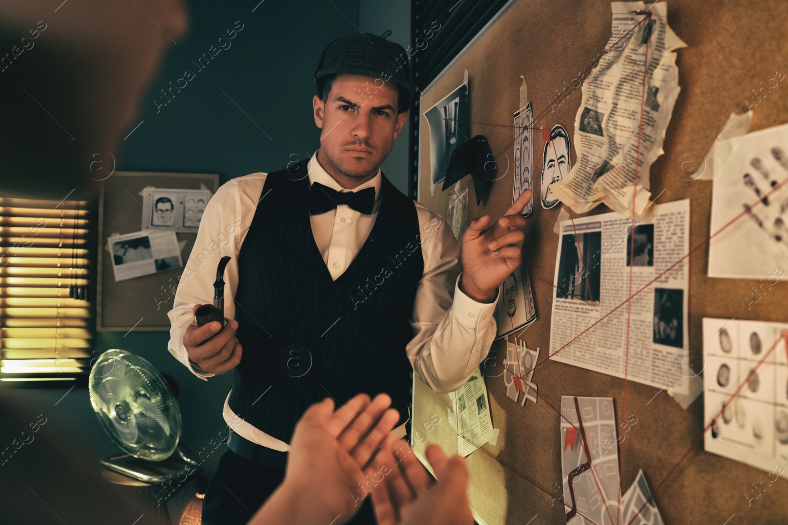 Photo of Old fashioned detective and his client near investigation board in office