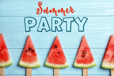 Image of Summer party. Watermelon popsicles on blue wooden background, flat lay