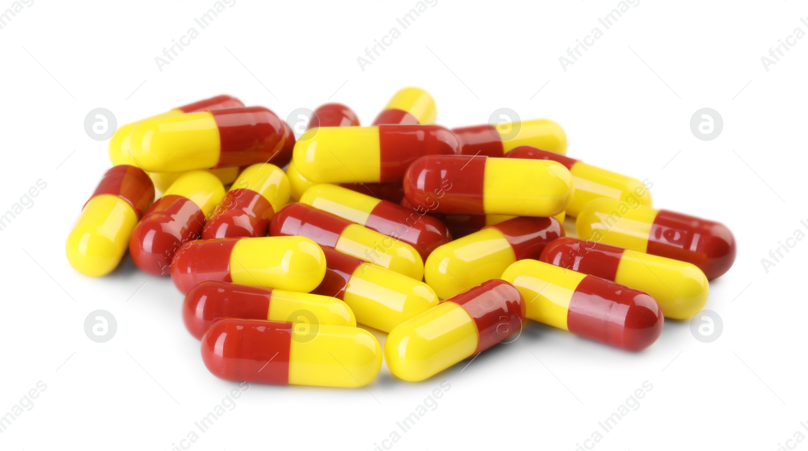 Photo of Many antibiotic pills isolated on white. Medicinal treatment