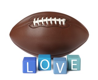 Photo of American football ball and cubes with word Love on white background