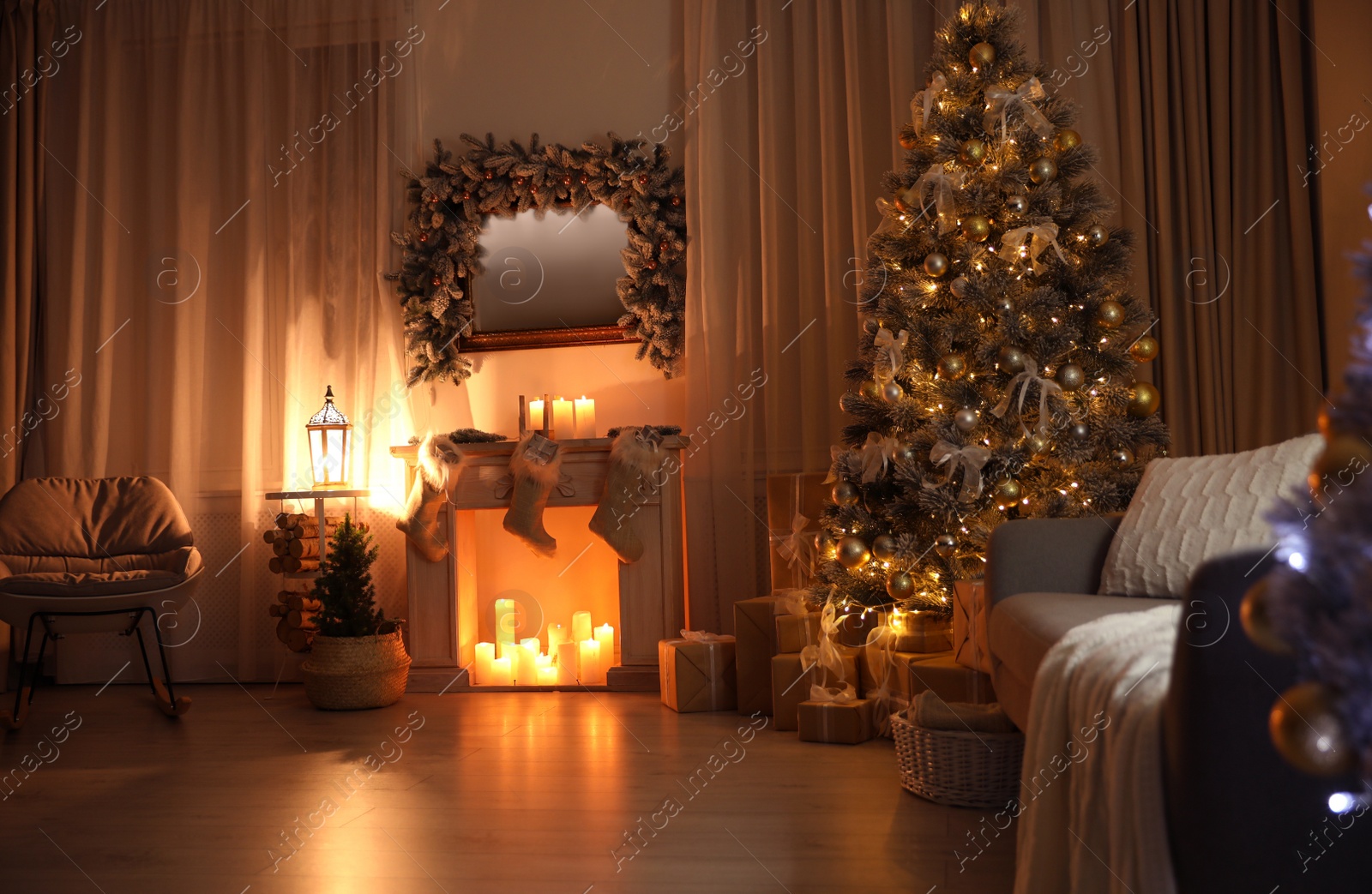 Photo of Stylish interior with beautiful Christmas tree and decorative fireplace at night