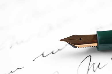 Elegant fountain pen on handwritten letter, closeup