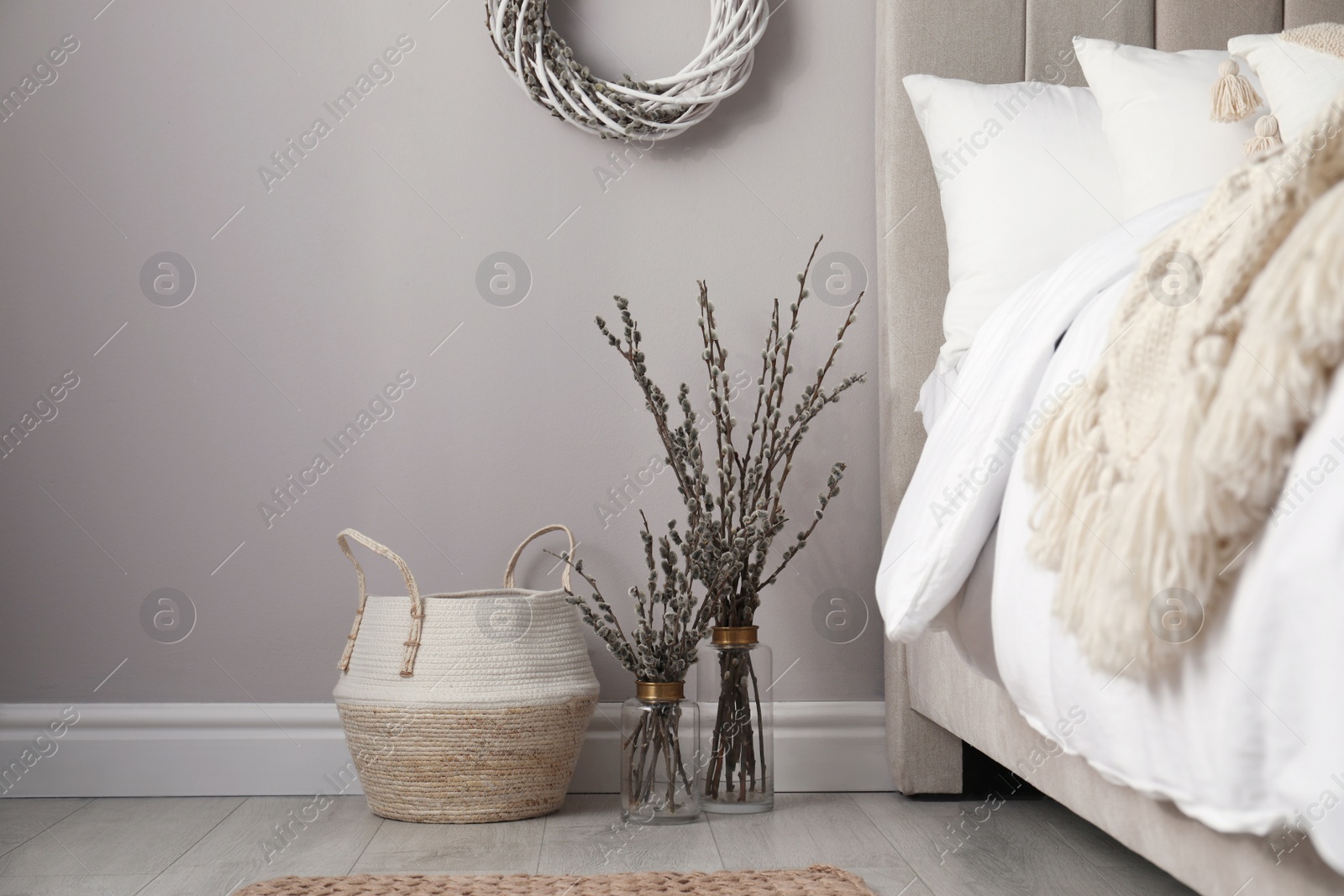 Photo of Bedroom interior with pussy willow branches and other decor