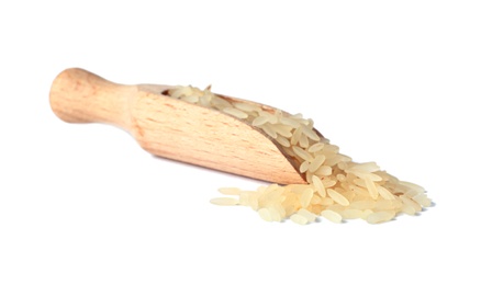 Scoop with uncooked parboiled rice on white background