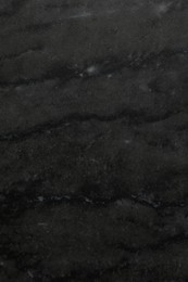 Photo of Black marble surface as background, closeup view