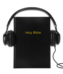 Photo of Bible and headphones on white background. Religious audiobook