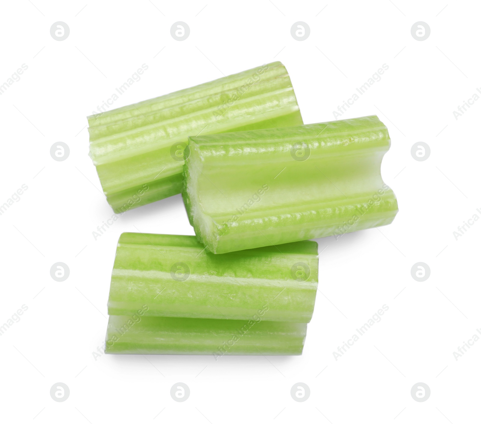 Photo of Fresh cut celery isolated on white, top view