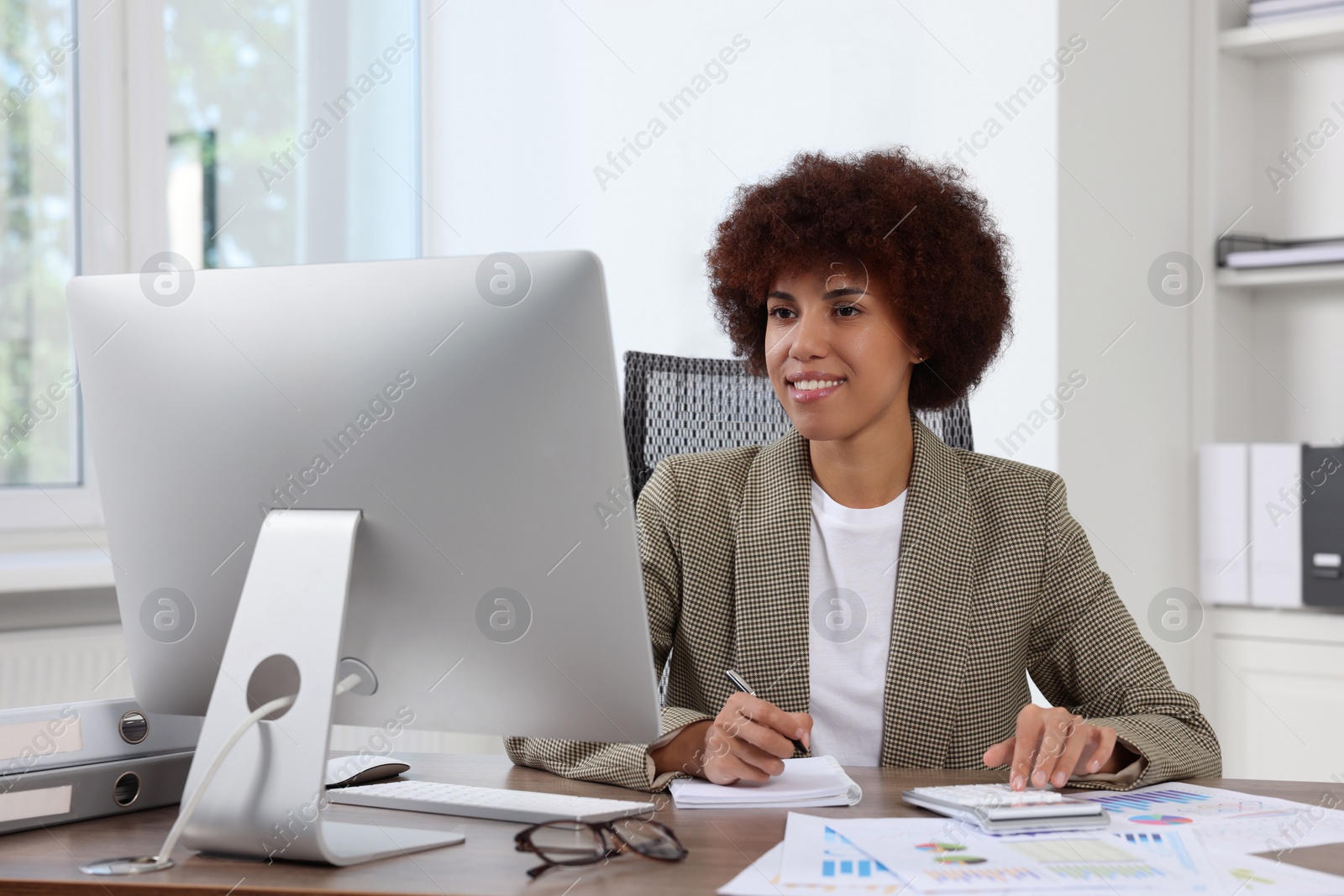 Photo of Professional accountant working on computer in office