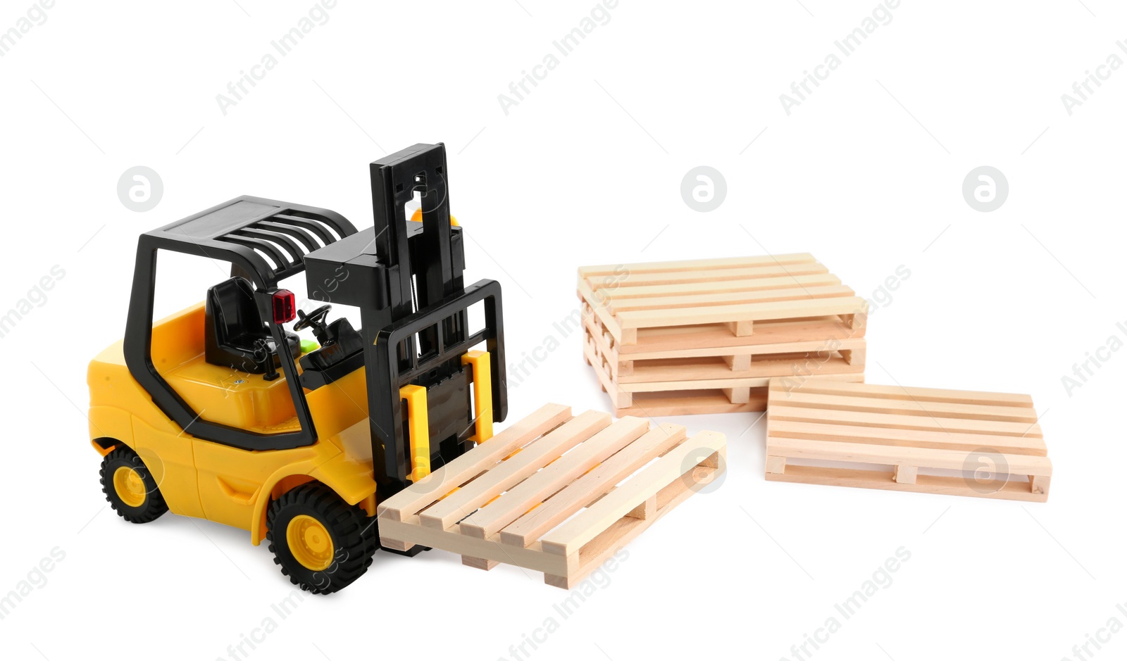 Photo of Toy forklift truck with wooden pallets on white background