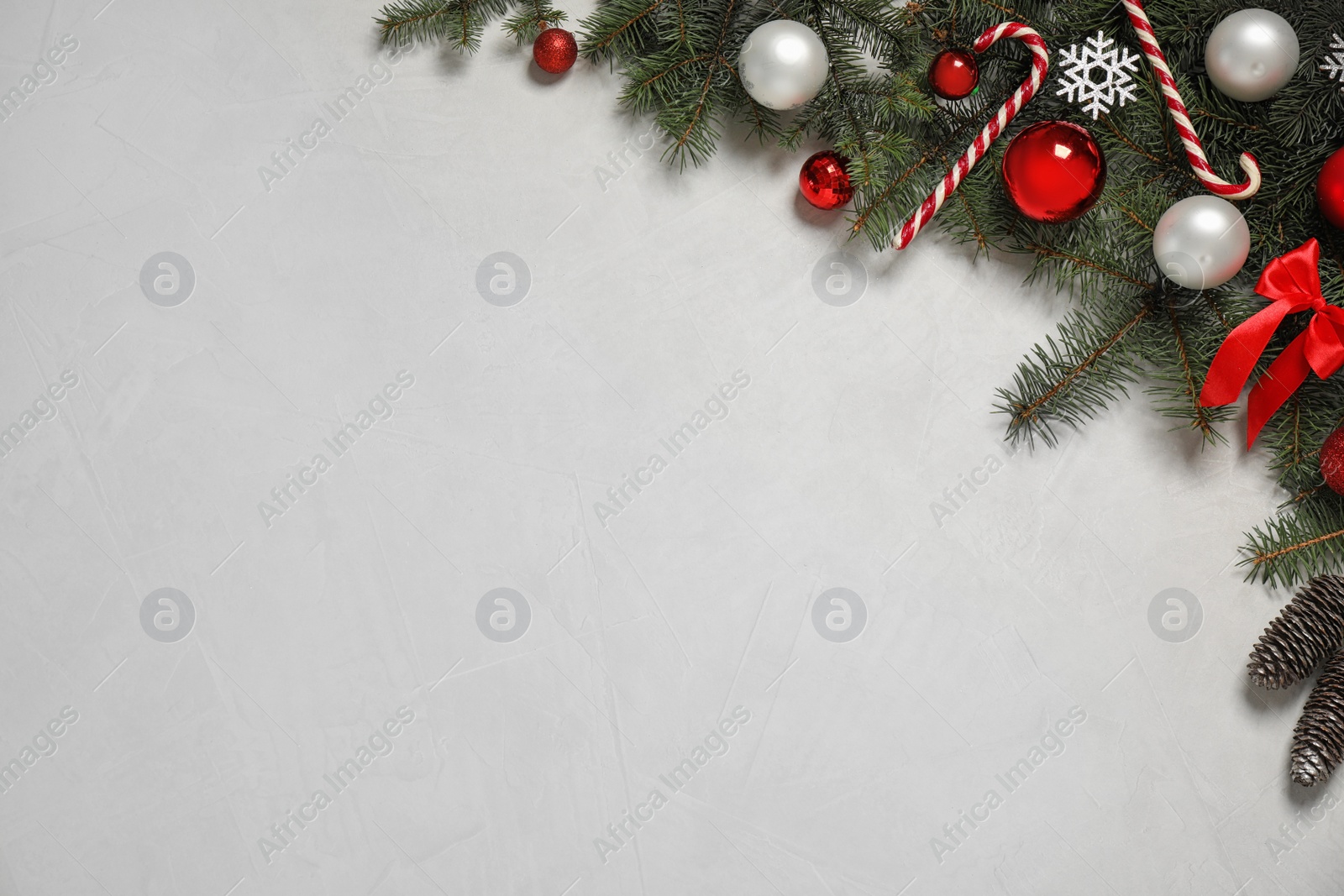 Photo of Christmas decoration light stone background, flat lay. Space for text