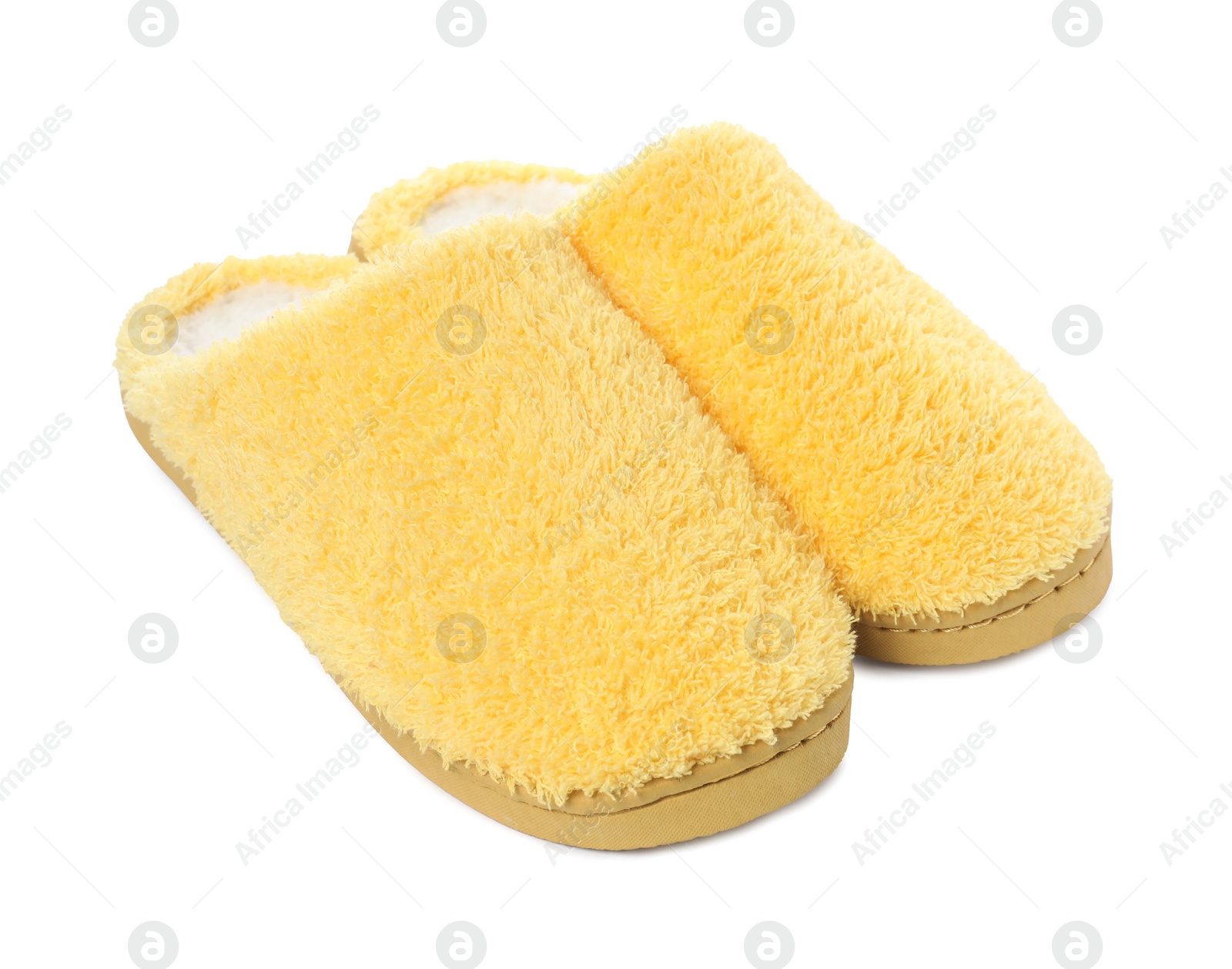 Photo of Pair of yellow soft slippers isolated on white