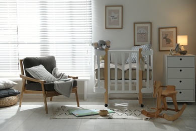 Baby room interior with crib, armchair and rocking horse. Idea for design