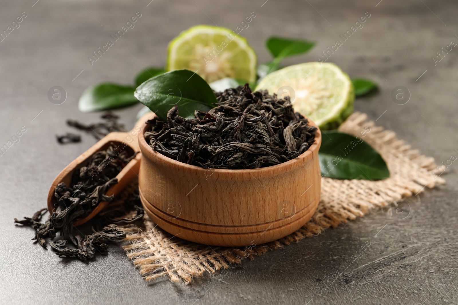 Photo of Dry bergamot tea leaves on grey table