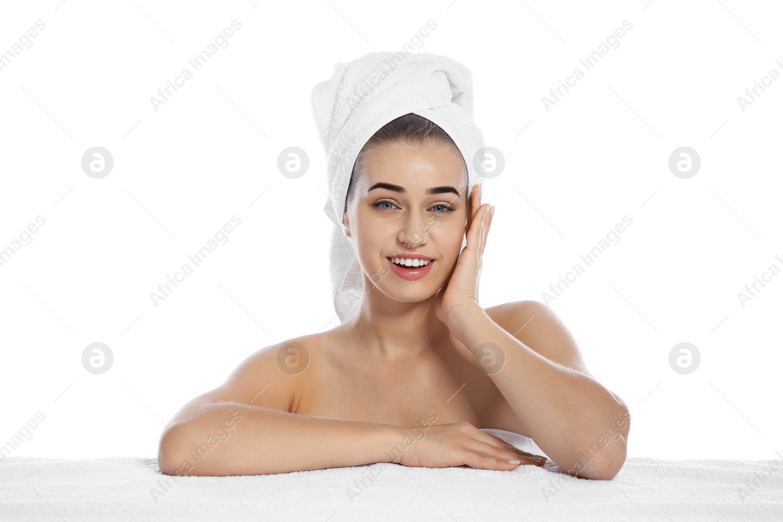 Photo of Portrait of young pretty woman with towel on white background