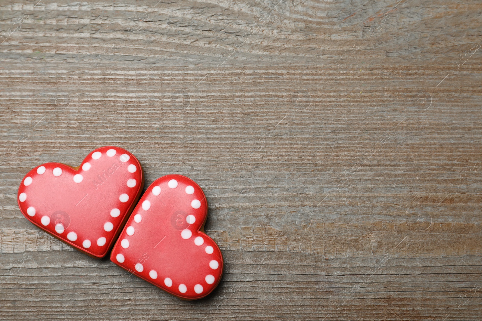 Photo of Heart shaped cookies on wooden table, flat lay with space for text. Valentine's day treat