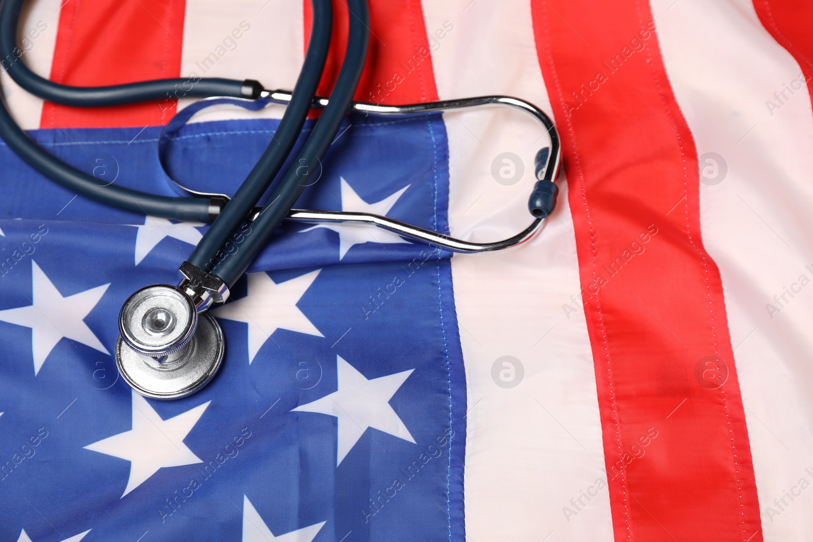 Photo of Stethoscope on USA flag, above view. Health care concept