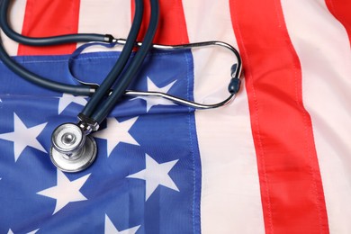 Photo of Stethoscope on USA flag, above view. Health care concept