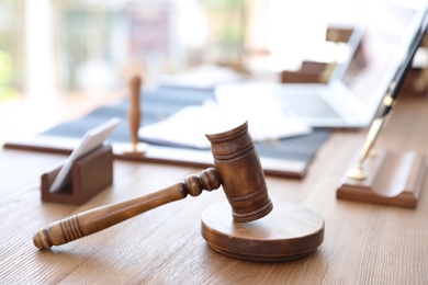 Photo of Wooden gavel on desk in notary's office