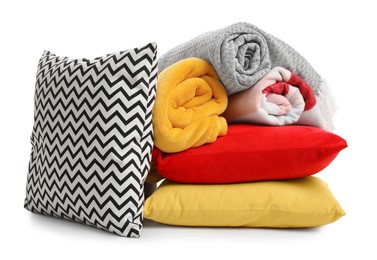 Photo of Stylish soft pillows and blankets on white background