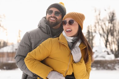 Beautiful happy couple spending time together on winter day