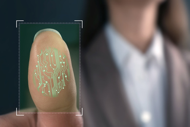 Image of Businesswoman using biometric fingerprint scanner, closeup. Space for text