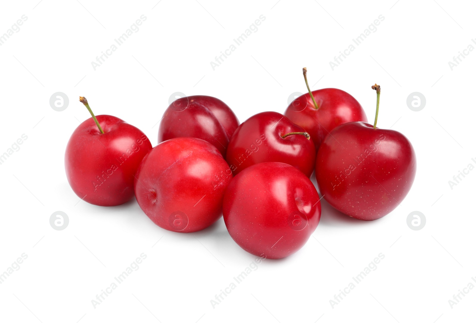 Photo of Delicious ripe cherry plums on white background