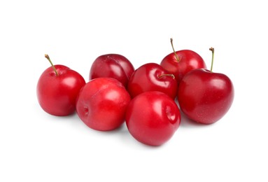 Photo of Delicious ripe cherry plums on white background