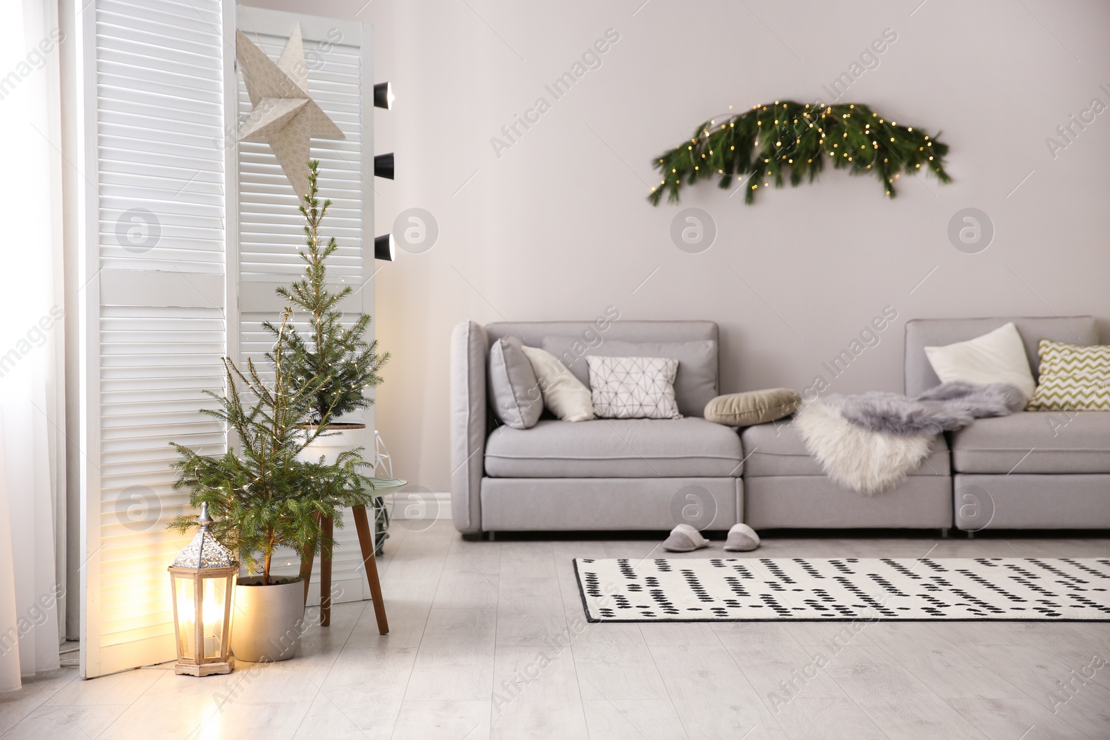 Photo of Stylish living room with Christmas decorations. Interior design