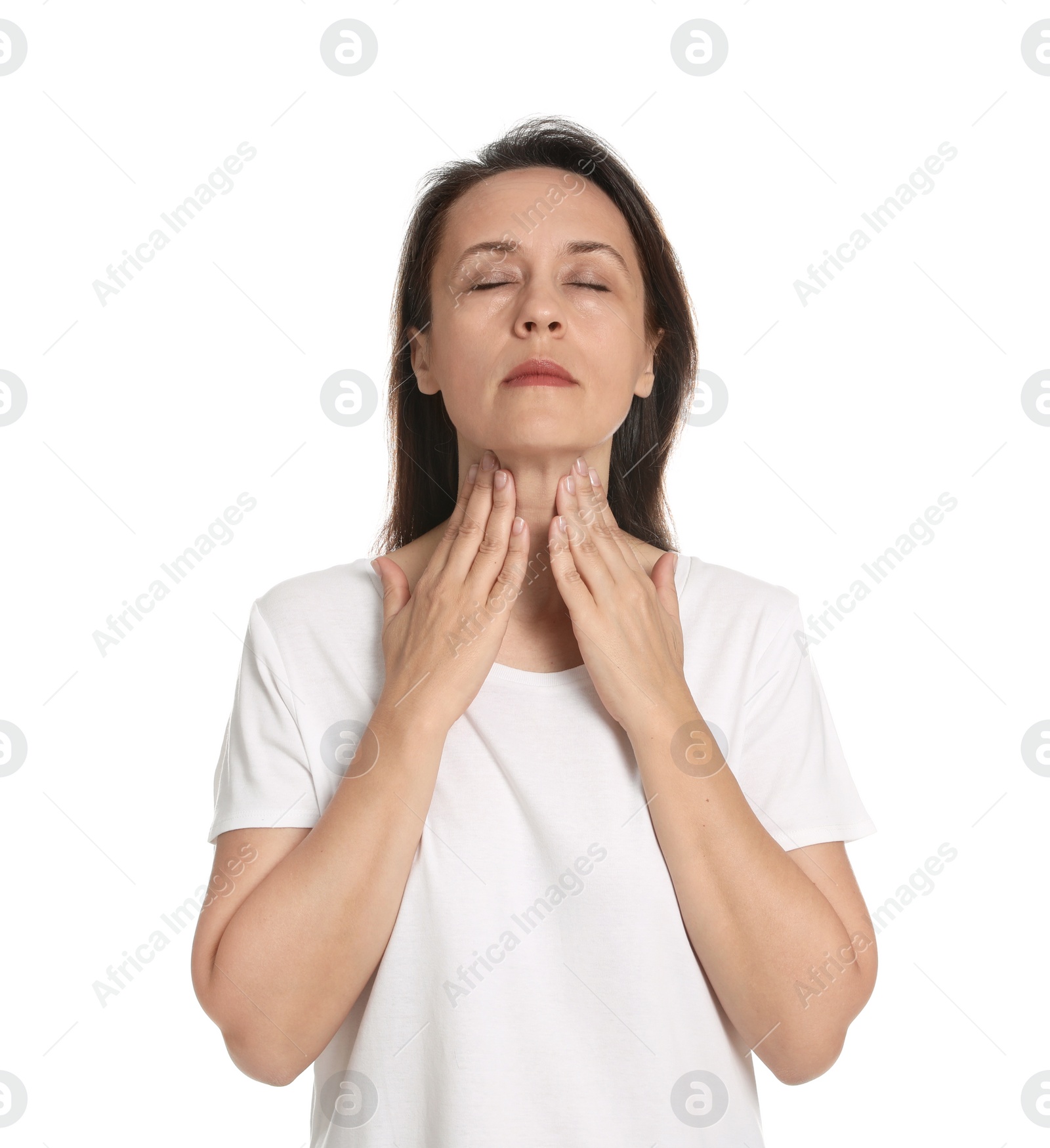 Photo of Mature woman doing thyroid self examination on white background