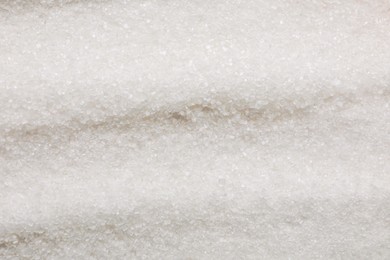 Granulated white sugar as background, top view