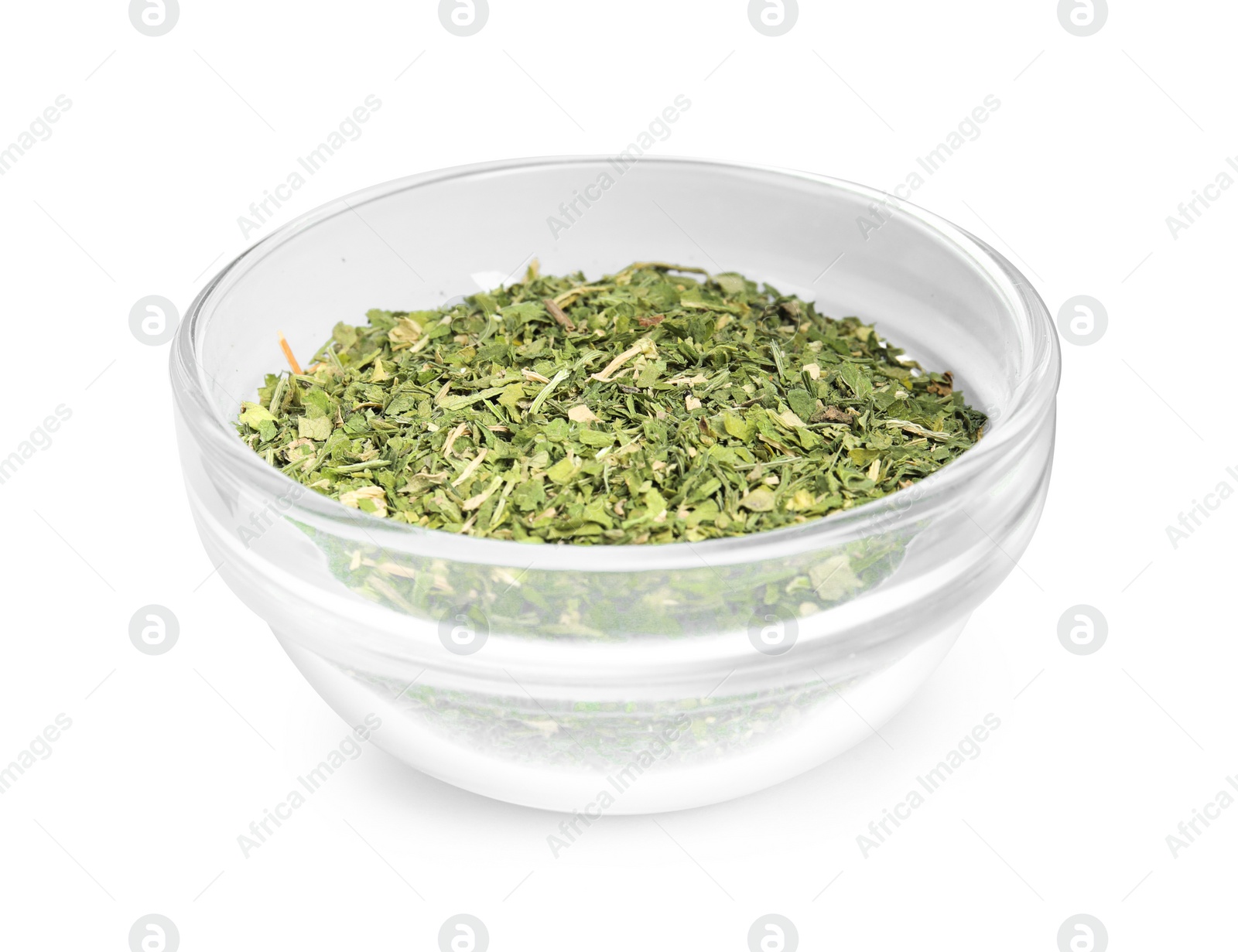 Photo of Bowl with dried parsley on white background