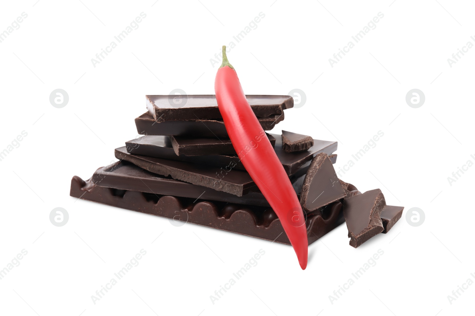 Photo of Red hot chili pepper and pieces of dark chocolate isolated on white