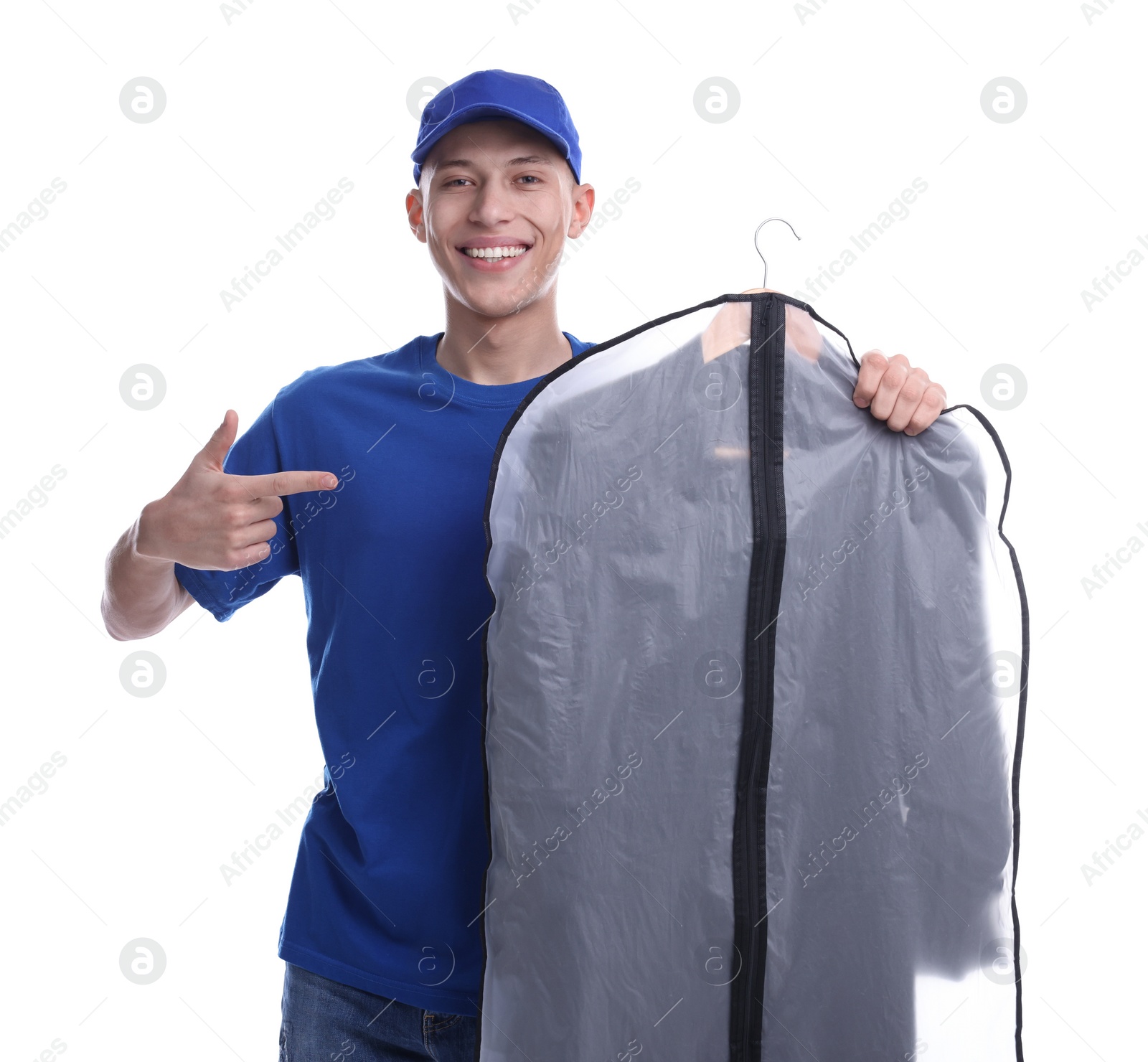 Photo of Dry-cleaning delivery. Happy courier holding garment cover with clothes on white background