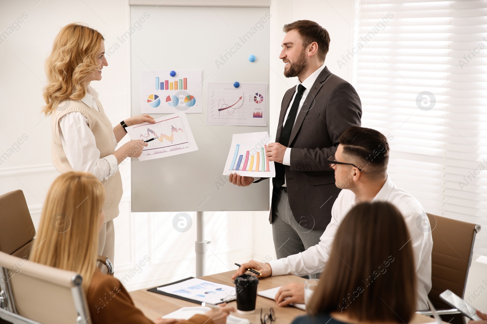 Photo of Businesspeople having meeting in office. Management consulting