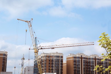 Photo of Construction site with tower crane near building