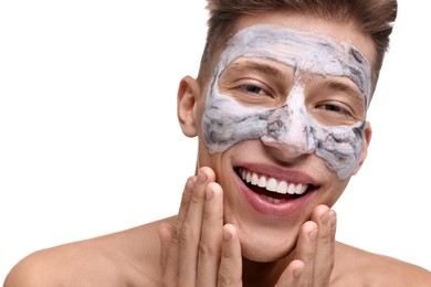 Photo of Handsome man with clay mask on his face against white background, closeup