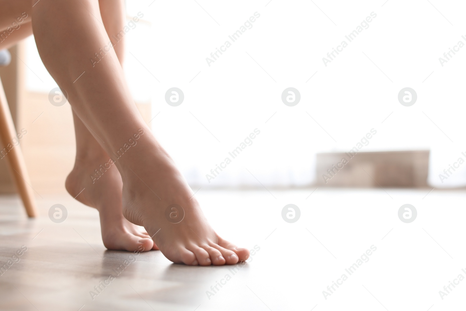 Photo of Young woman showing smooth silky skin after epilation at home