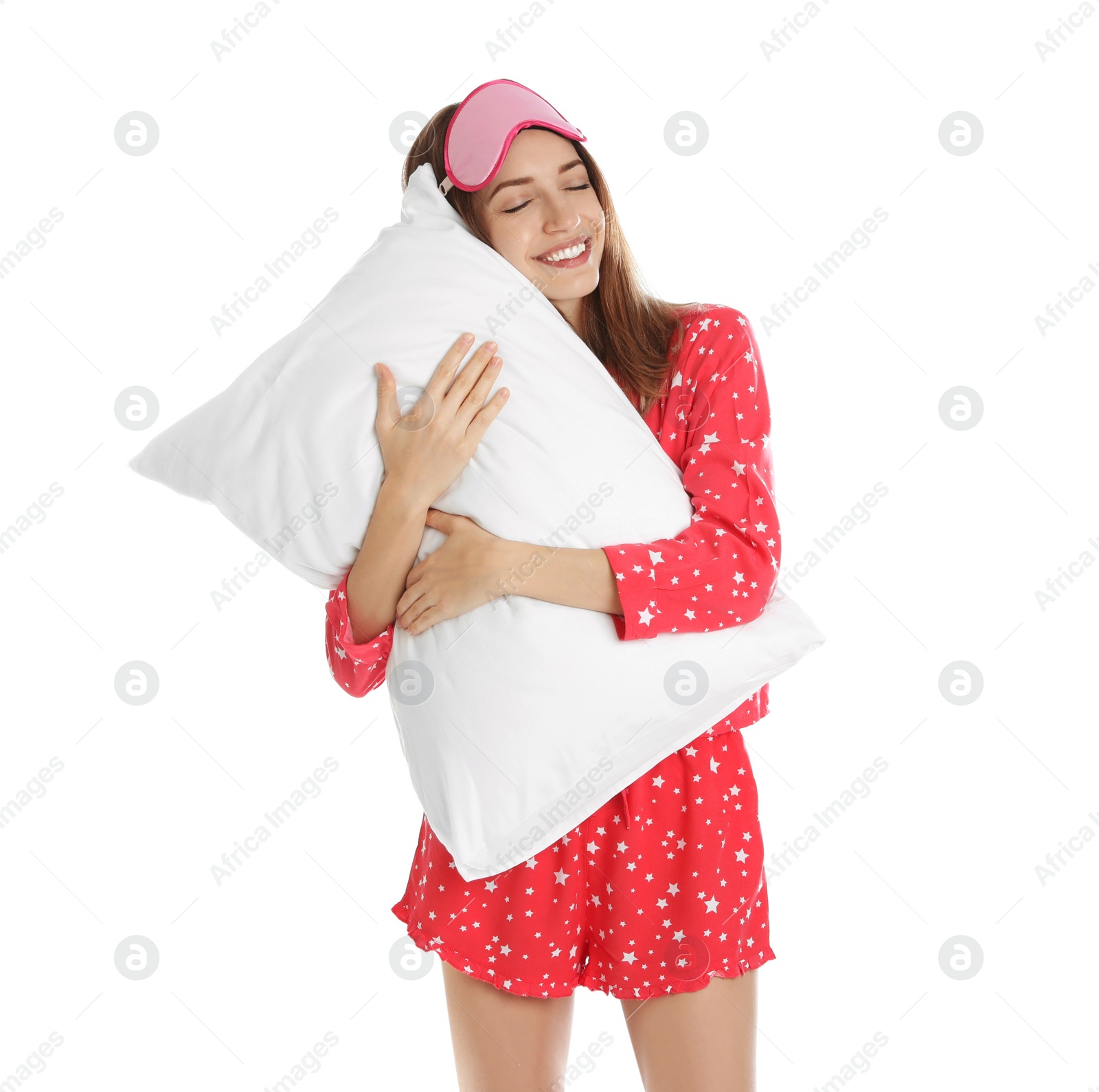 Photo of Beautiful woman with pillow and sleep mask on white background. Bedtime