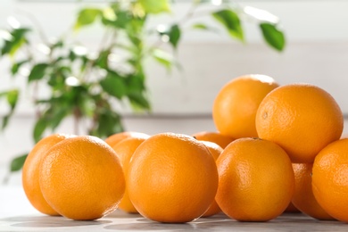 Photo of Fresh juicy oranges on table, space for text. Healthy fruits