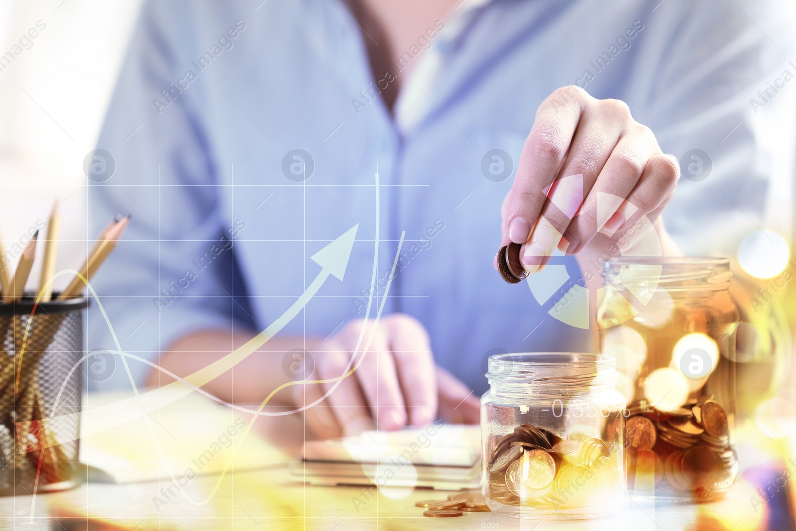 Image of Woman putting money into glass jar at table, closeup