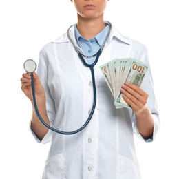 Doctor with bribe and stethoscope on white background, closeup. Corruption in medicine