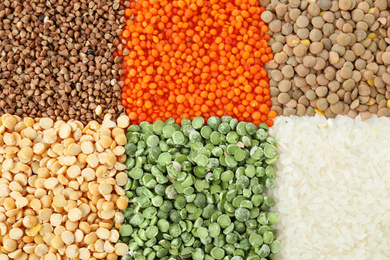 Photo of Different grains and cereals as background, top view