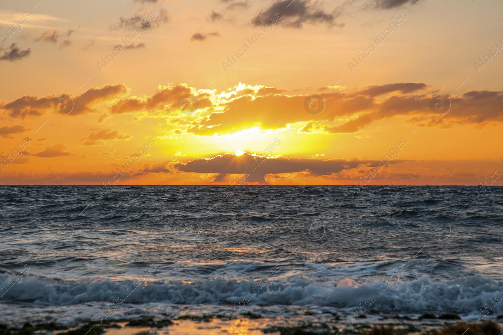 Photo of Picturesque view of sea under sky at beautiful sunset