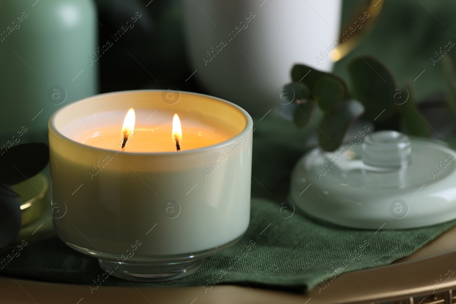 Photo of Beautiful burning candle on table, closeup. Space for text