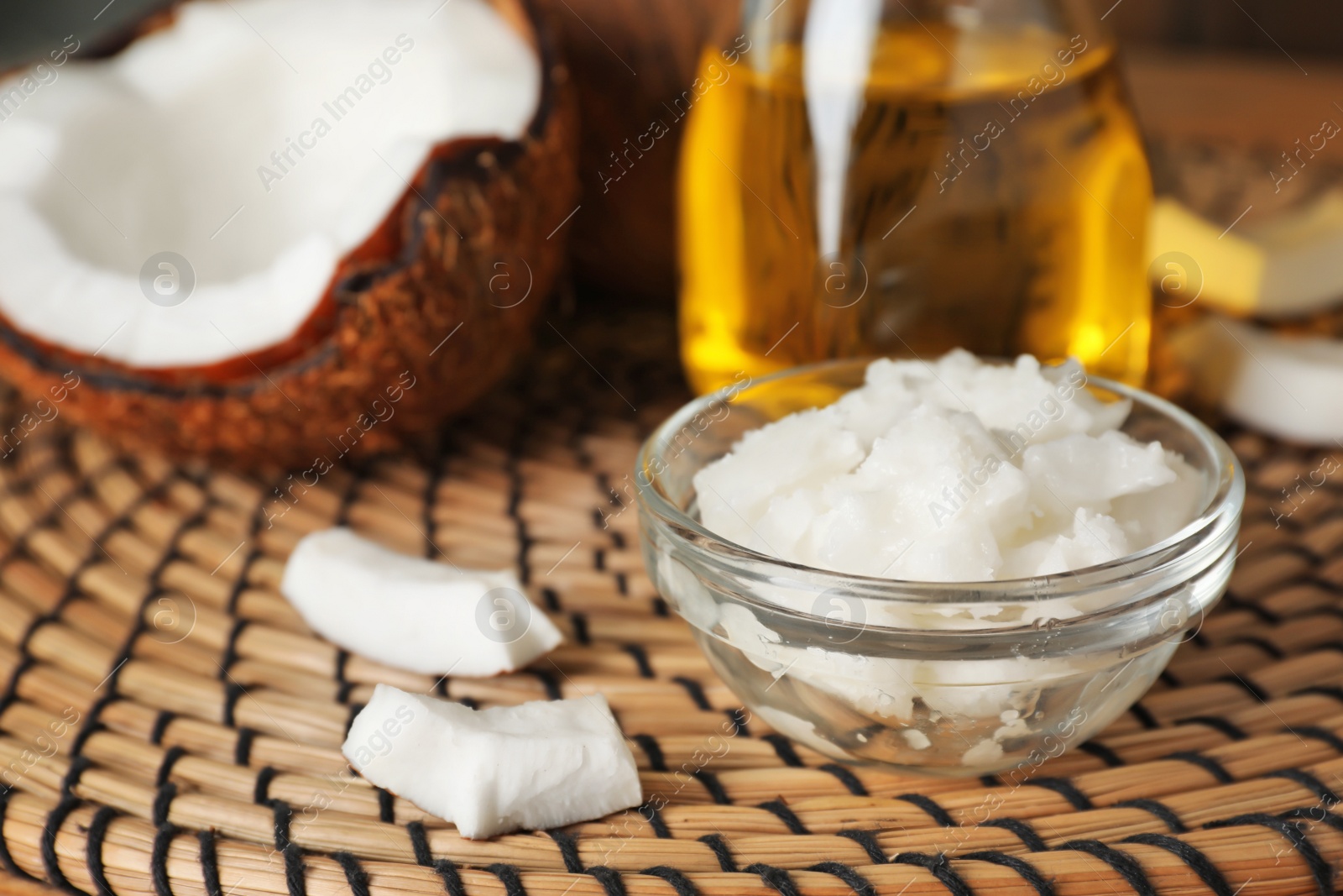 Photo of Bowl with coconut oil on table. Healthy cooking