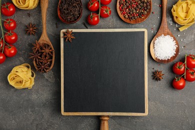 Photo of Blank chalkboard and different fresh products on grey table, flat lay with space for text. Cooking Classes