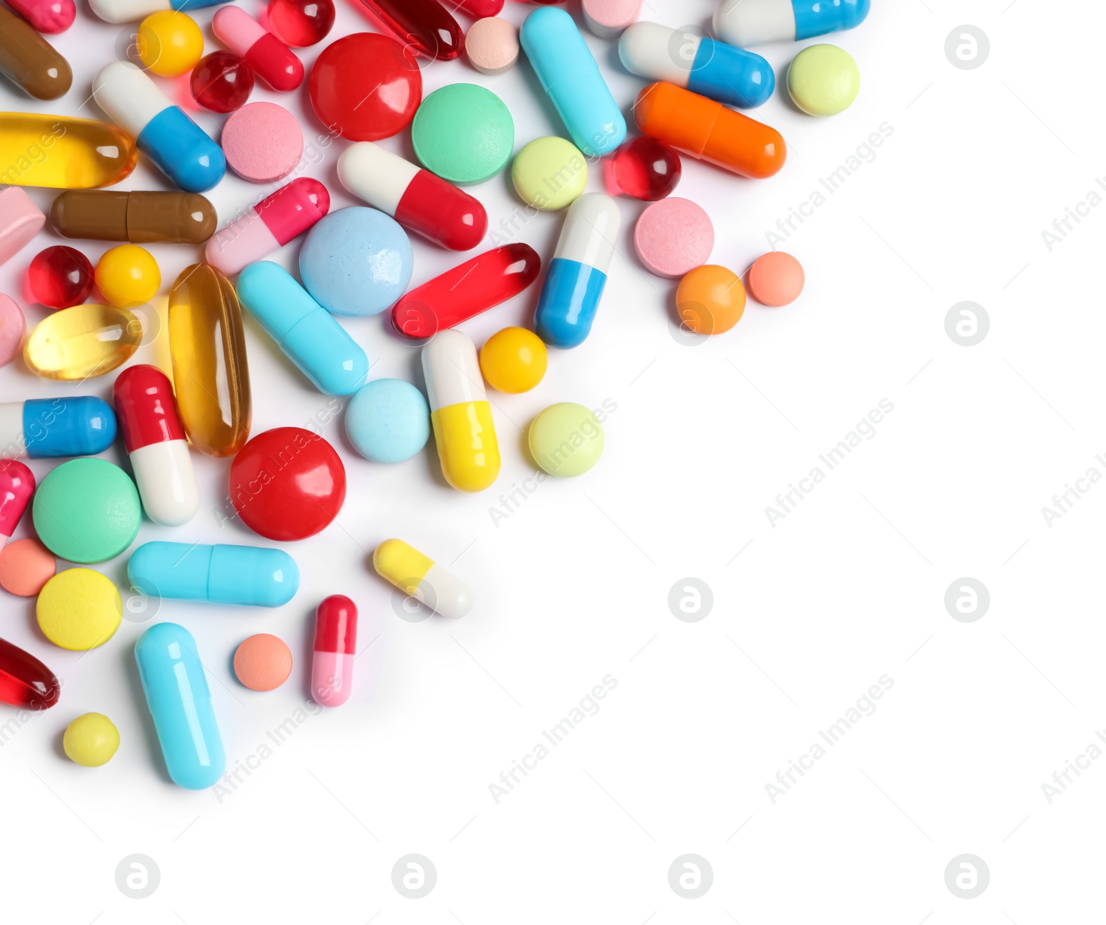 Photo of Lots of different colorful pills isolated on white, top view