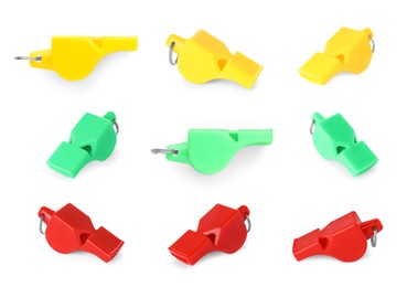 Different colourful whistles isolated on white, set